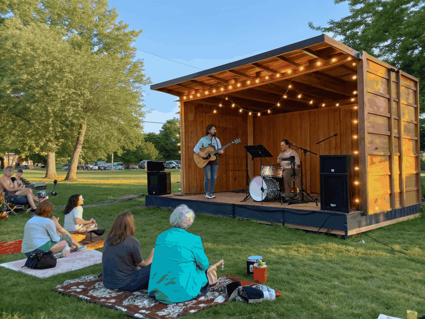 Community celebration moment featuring music and shared meals