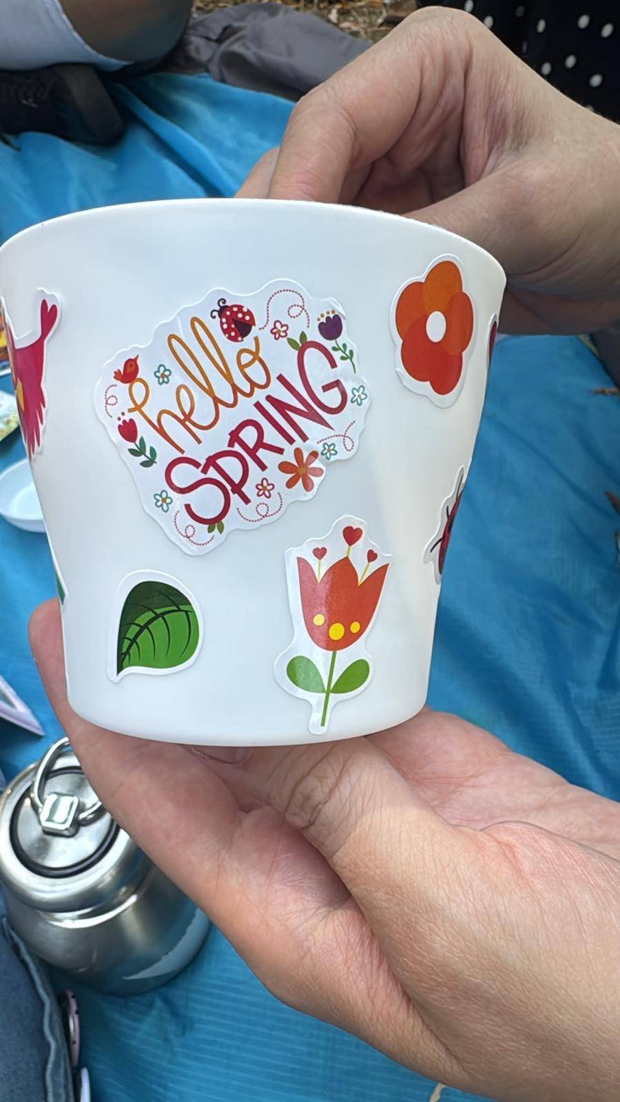 Hands planting seeds in rich soil